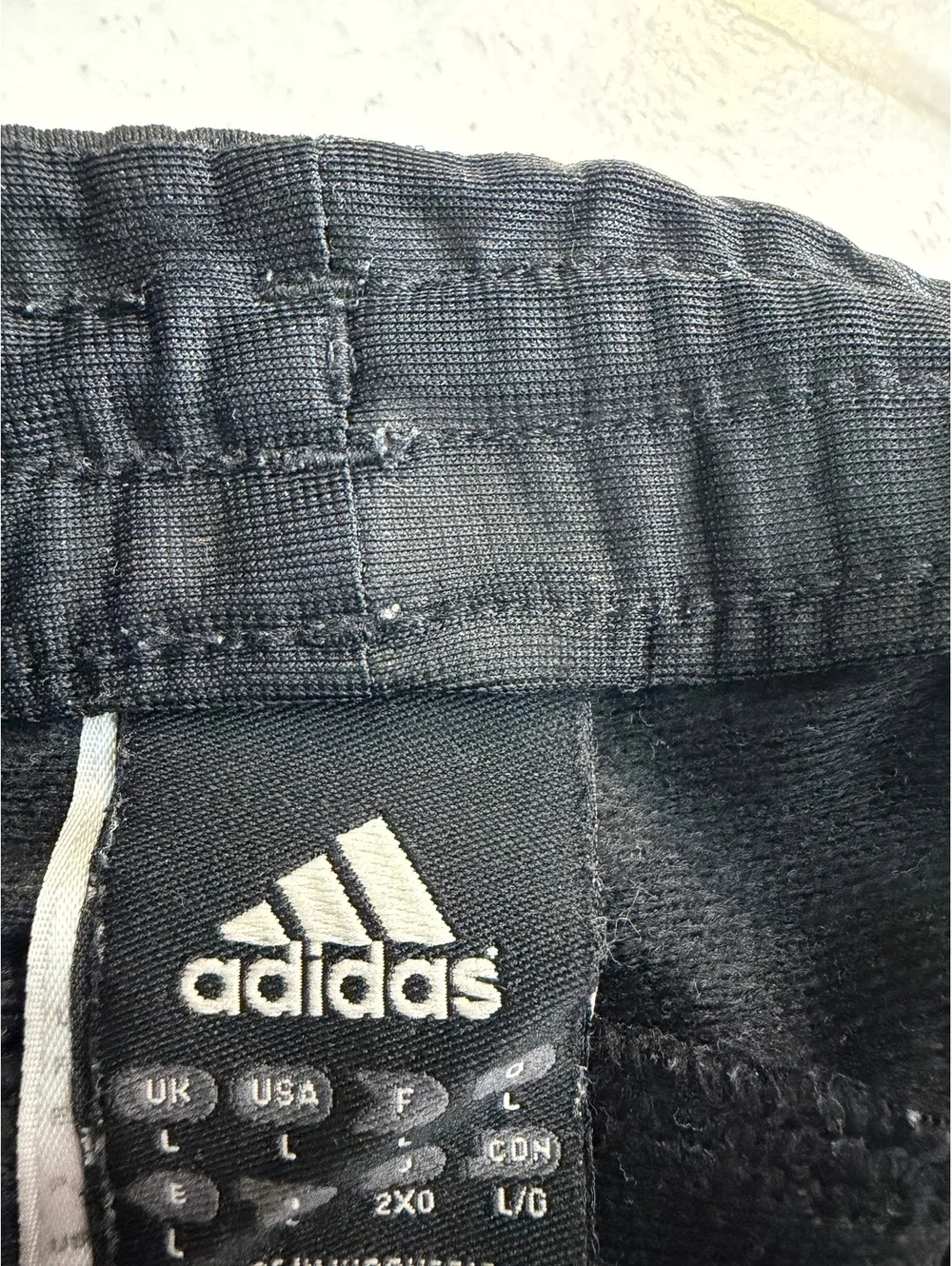 adidas black track pants with white stripes
